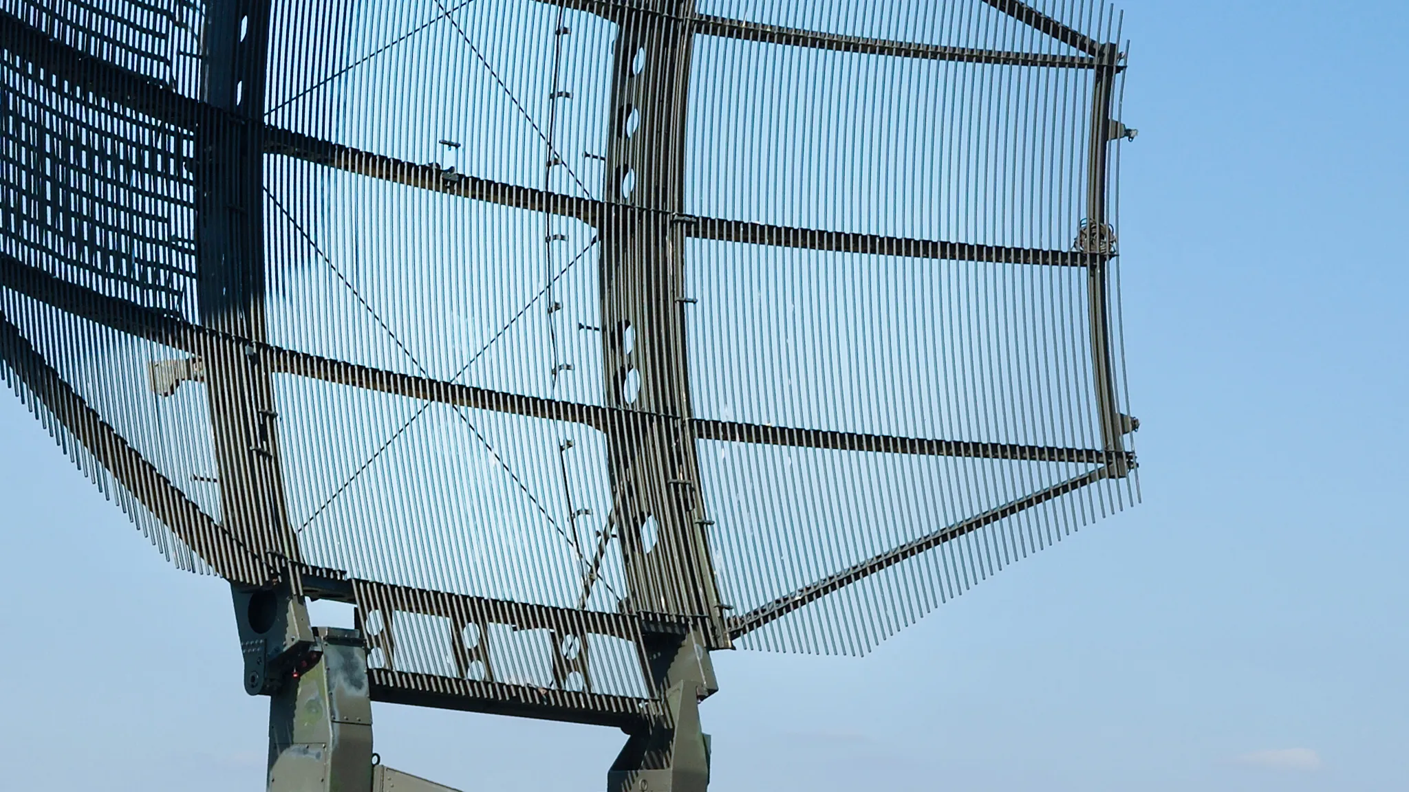 Defence and security Military satellite dish under blue sky