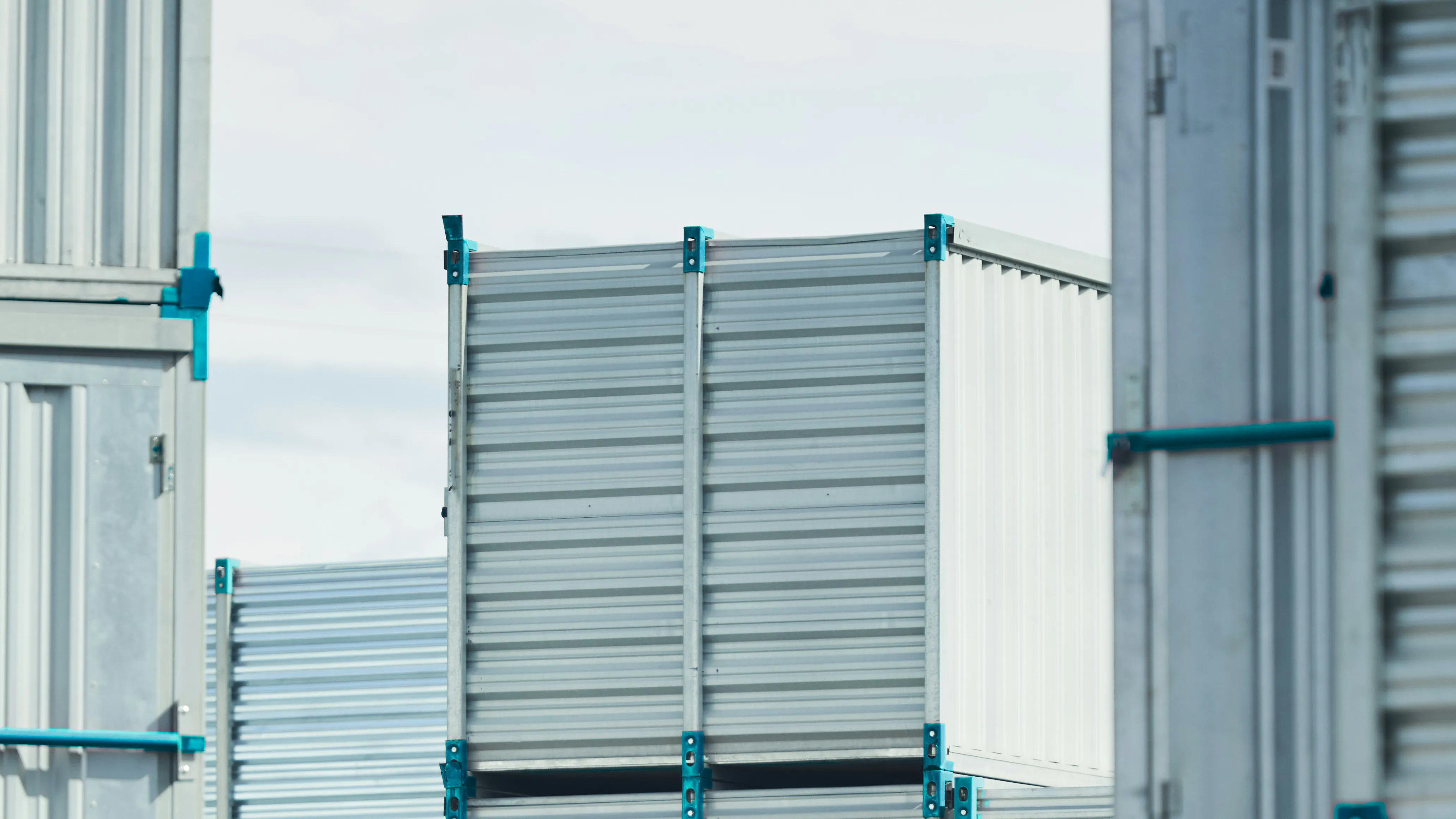 Supply chain management illustration Grey freight containers with blue accents